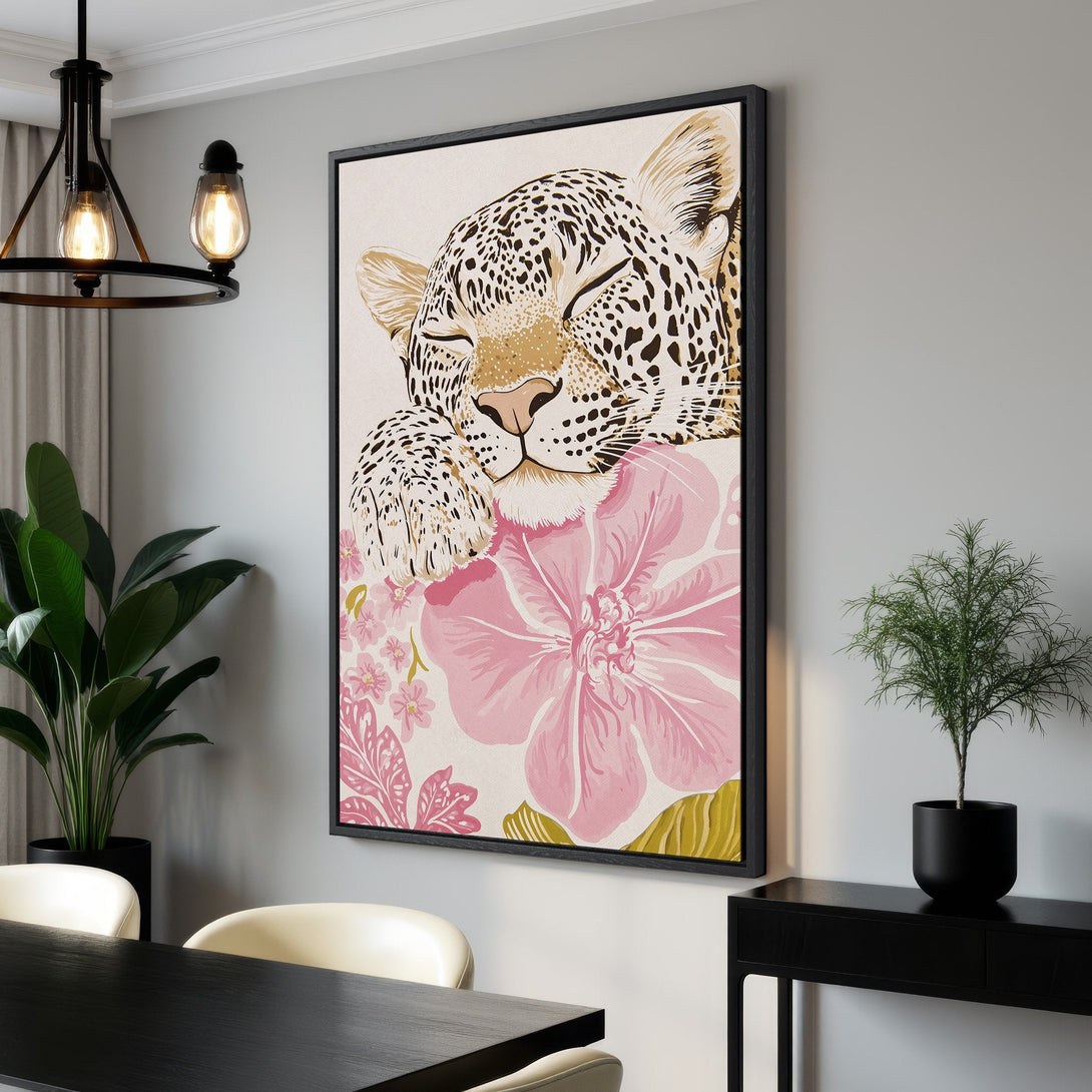 Framed Wall Art featuring a sleeping leopard with pink floral accents. Modern, stylish canvas print with a neutral and pink color palette, perfect for home decor.