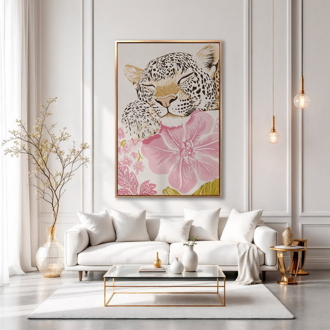 Framed Wall Art featuring a leopard with floral accents in a modern interior. Soft pinks and gold hues create an elegant, stylish canvas print.