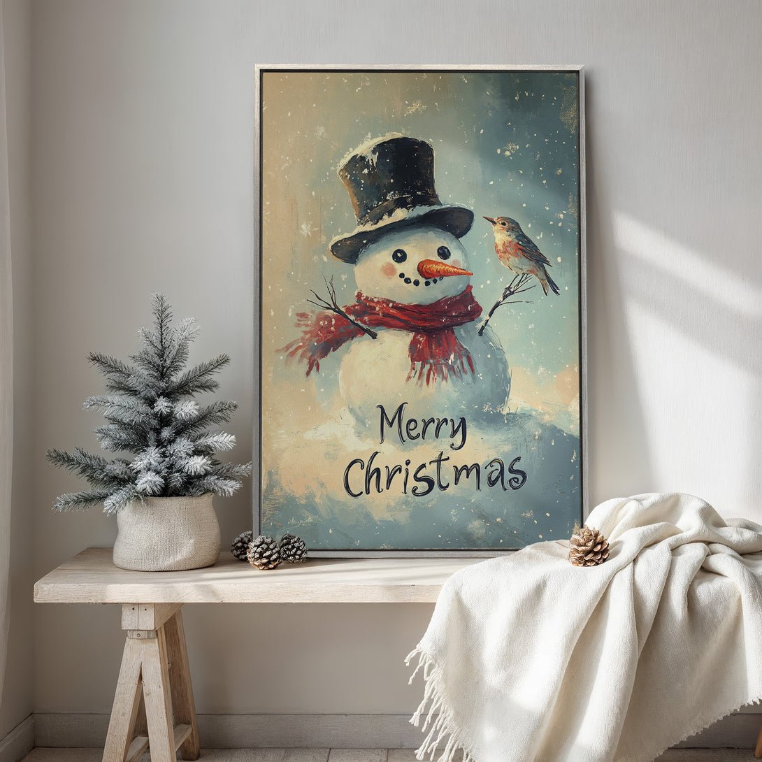 Framed Wall Art: Festive snowman art print in a vintage style, featuring a winter scene with a bird. Soft blue, white, and red color palette for cozy Christmas decor.