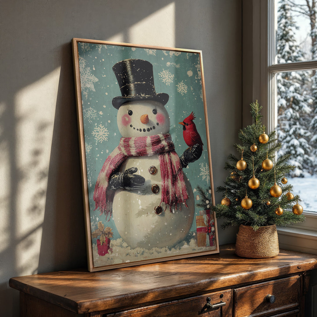 Framed Wall Art: Vintage snowman print with a red cardinal, in a rustic style. Features a blue and red color palette, perfect for holiday decor.