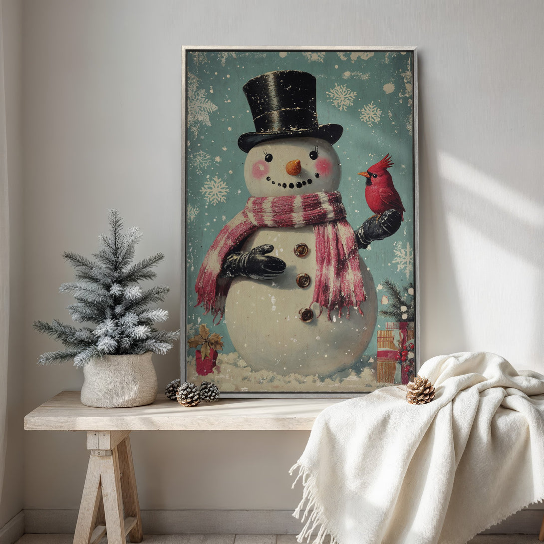 Framed Wall Art: Vintage snowman print with a red cardinal on a teal background. Festive winter decor in a cozy, neutral-toned interior.