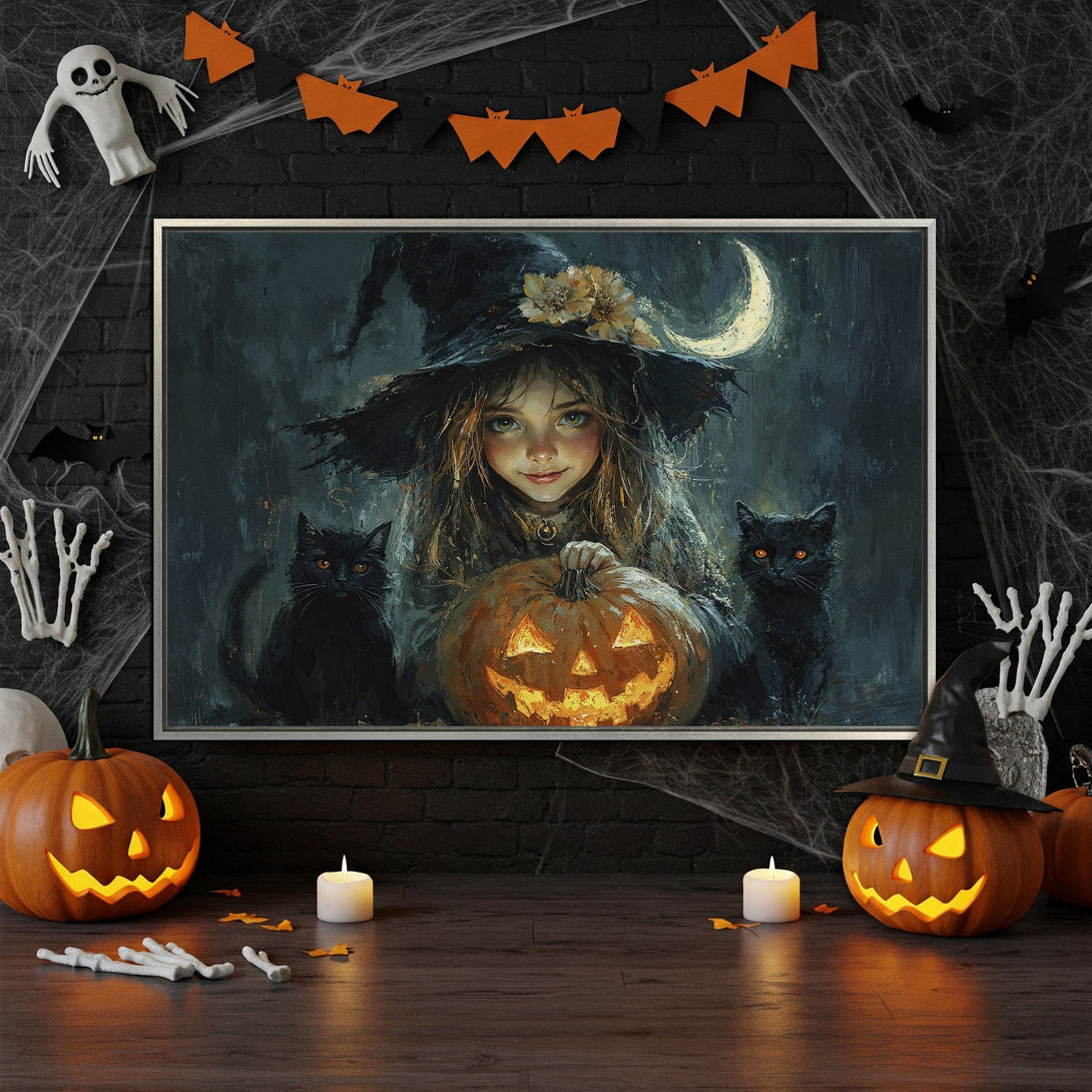 Framed Wall Art featuring a witch with black cats, pumpkin, and moon. Dark, moody color palette perfect for Halloween decor.