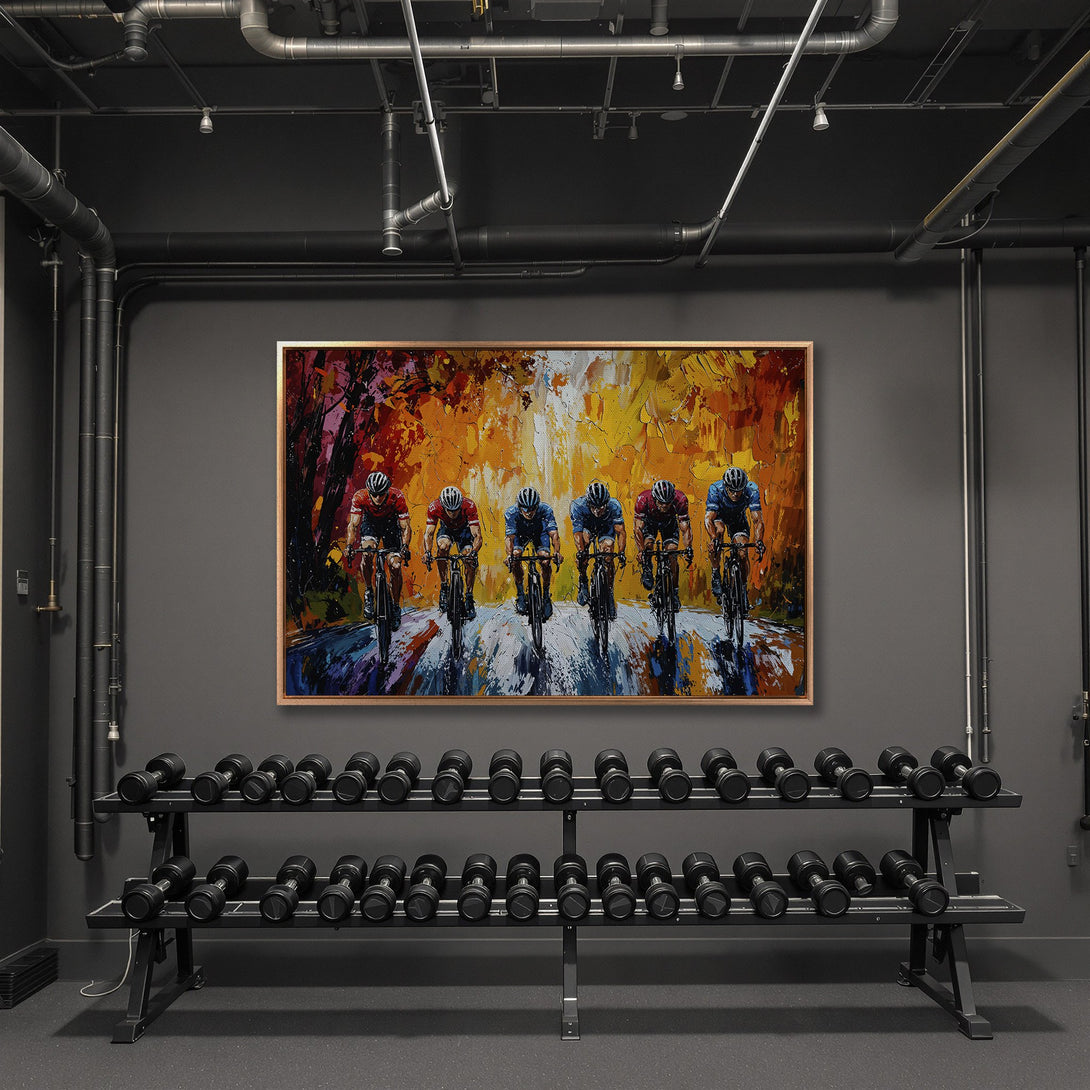 Framed Wall Art of cyclists in a vibrant, impressionistic style. Warm orange, red, and blue color palette. Perfect for home or gym decor.