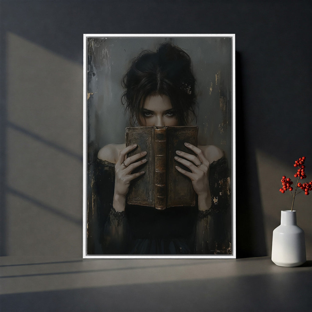 Framed Wall Art: Gothic portrait of a woman with a book. Moody, dark aesthetic with grey and black tones. Perfect for adding a touch of mystery to your space.