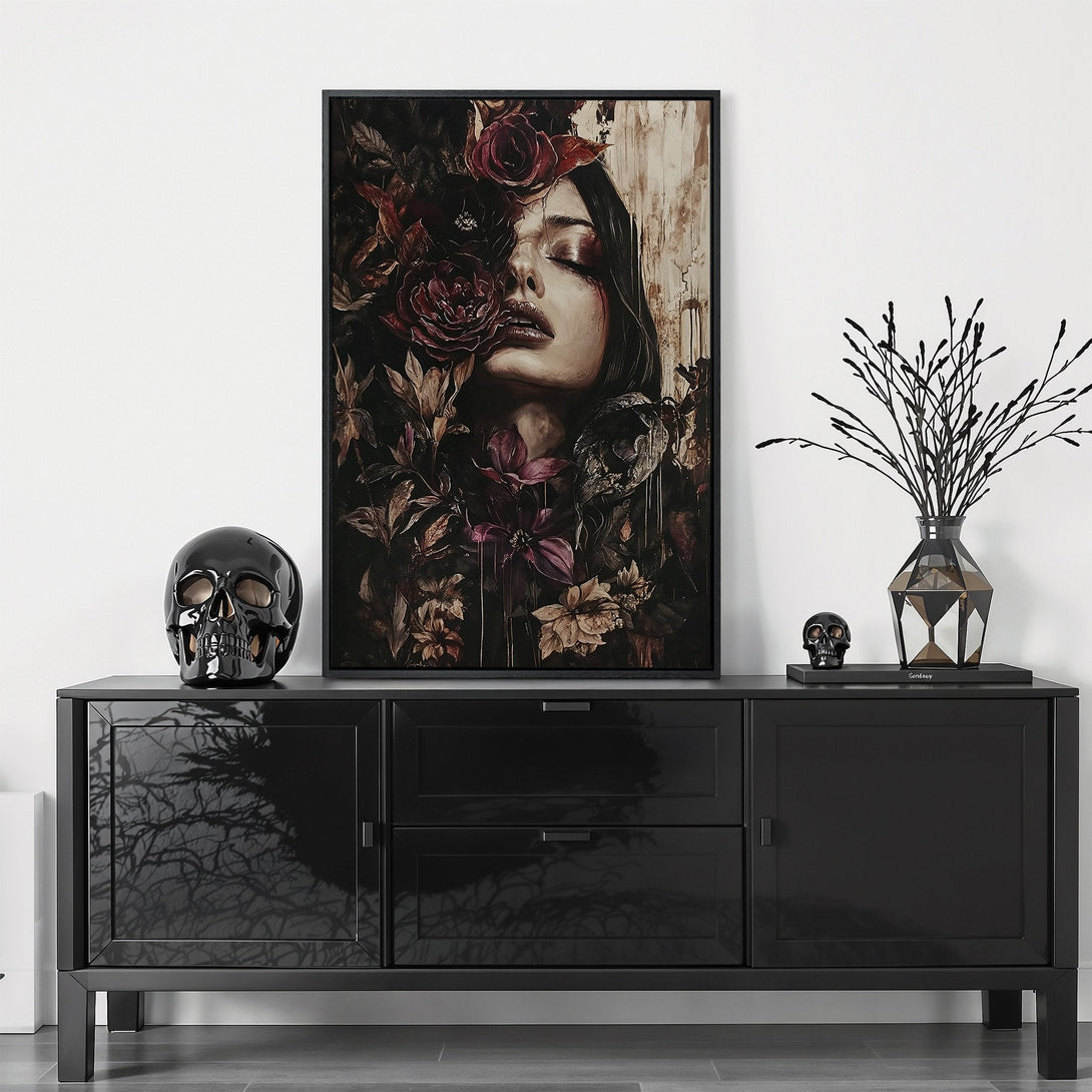 Framed Wall Art featuring a woman's face surrounded by flowers, in a dark, moody style with a rich red and black color palette. Perfect for a modern home.