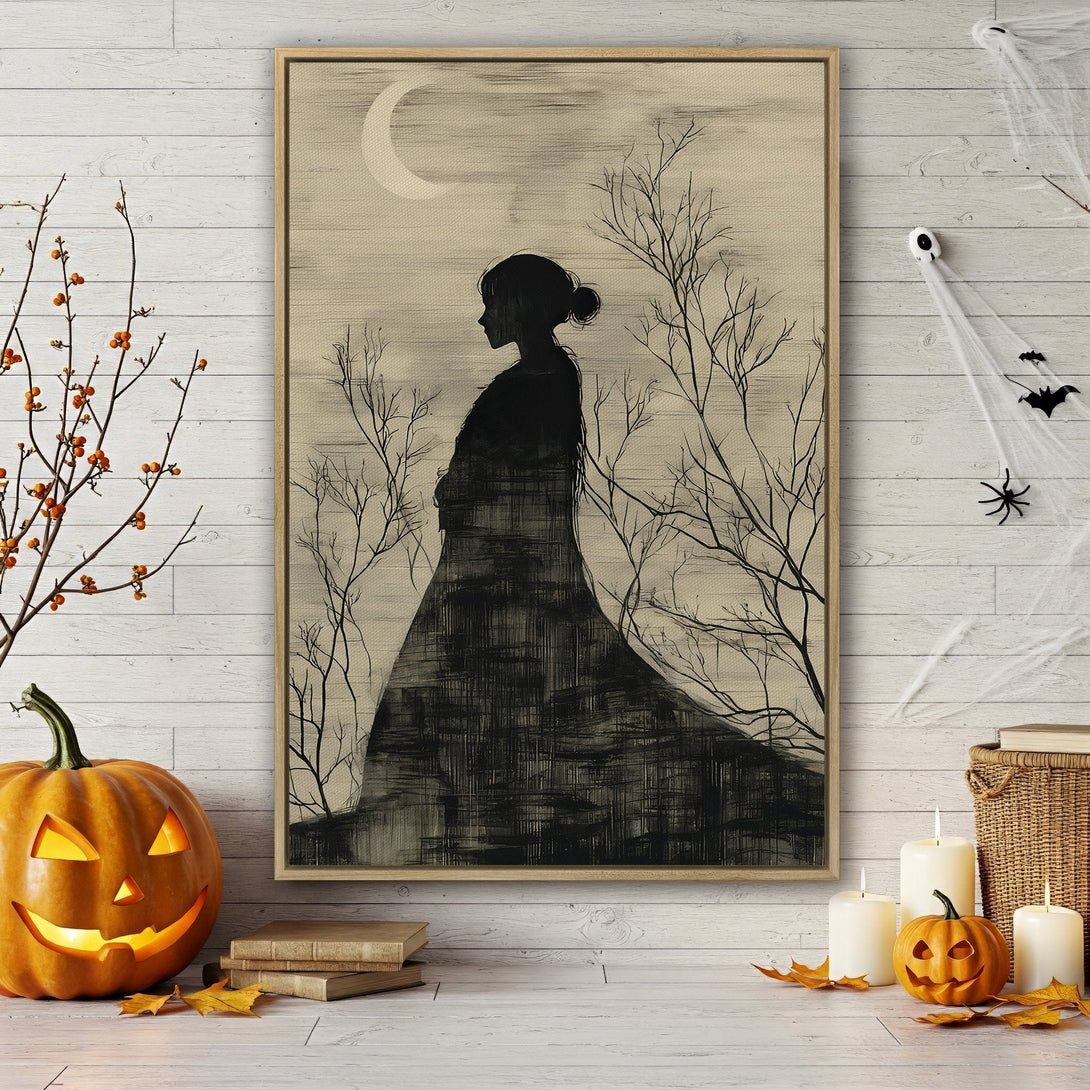 Framed Wall Art: Silhouette of a woman in a black dress with a spooky, vintage style. Neutral color palette with a touch of Halloween decor.