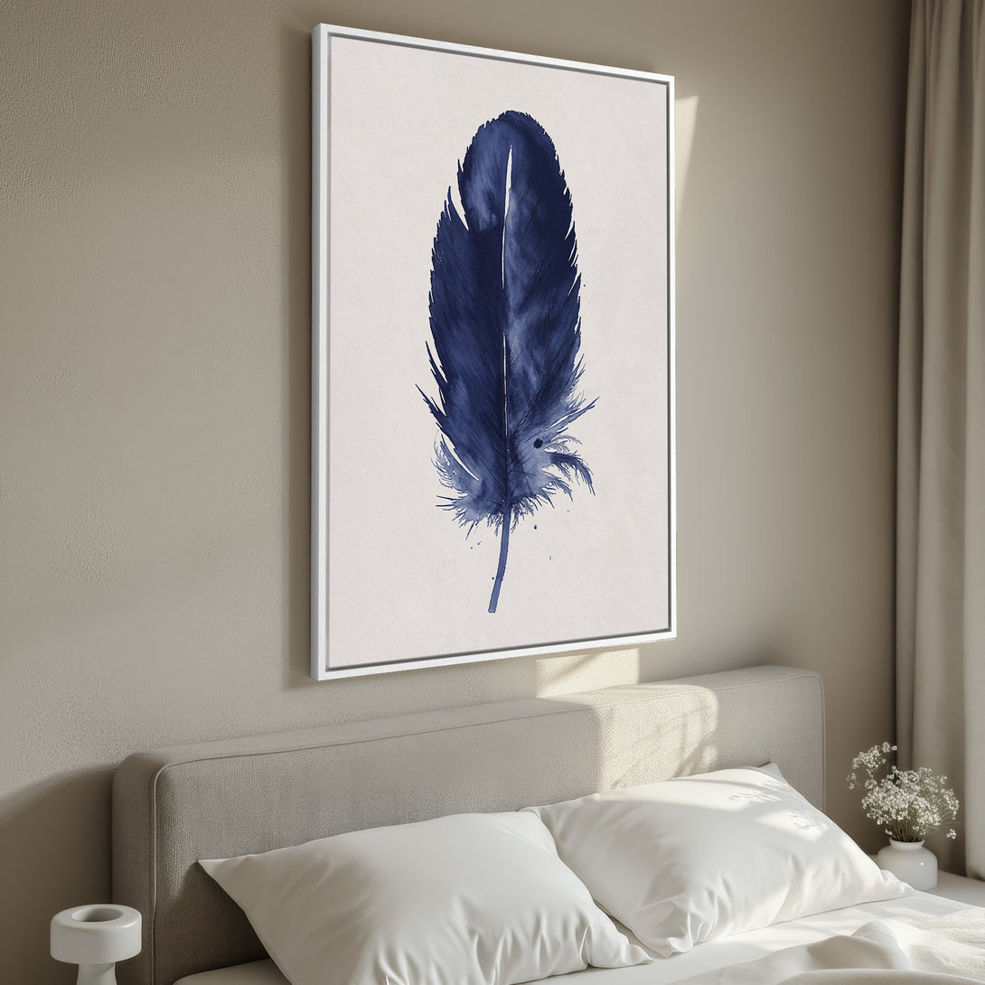 Framed Wall Art featuring a watercolor-style blue feather print. Modern, minimalist design with a neutral color palette, perfect for bedroom decor.