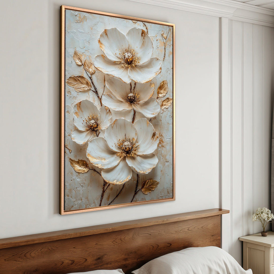 Framed Wall Art featuring white floral design with gold accents. Elegant canvas print, neutral color palette perfect for bedroom decor.