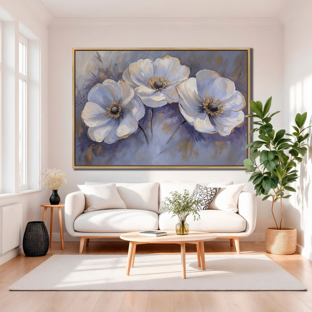 Framed Wall Art featuring elegant white floral painting with gold accents, displayed in a modern interior. Soft blue and neutral color palette for a serene aesthetic.