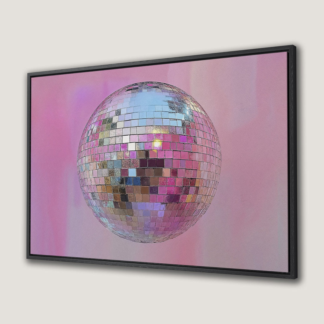 Framed Wall Art featuring a vibrant disco ball against a pink and purple background. Modern, stylish wall decor with a retro color palette.