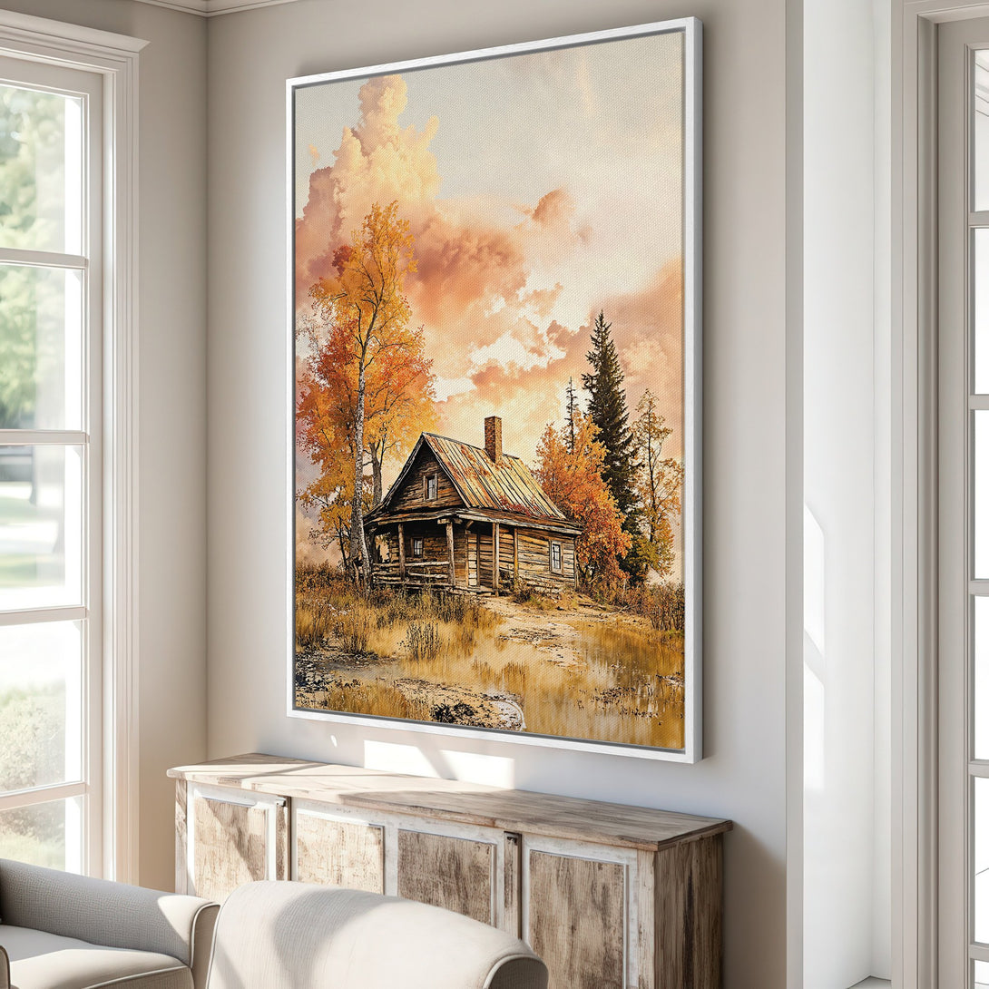 Framed Wall Art featuring a cozy cabin in a warm autumn landscape. Earthy tones and rustic style create a welcoming ambiance. Perfect for your home!