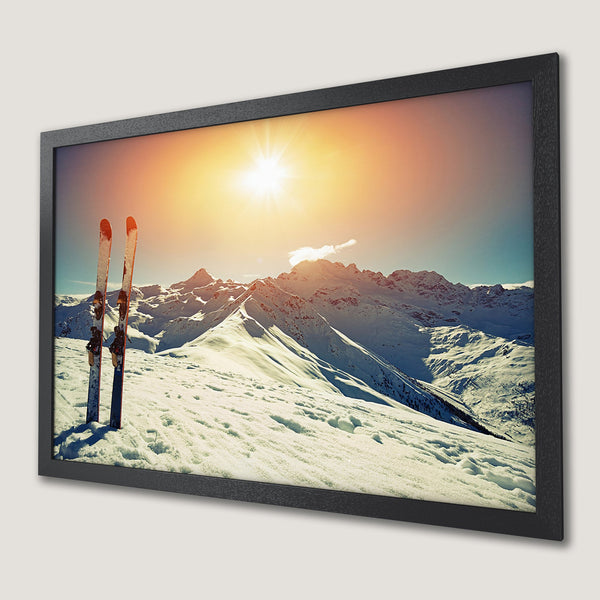 Framed Poster: Majestic mountain scene with skis, warm sunset colors. Add this stunning poster to your wall!
