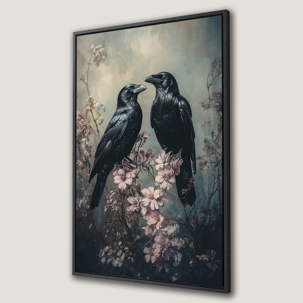 Framed Wall Art featuring two elegant ravens on a floral branch. Dark, moody color palette with hints of pink and blue. Perfect for a gothic-inspired interior.