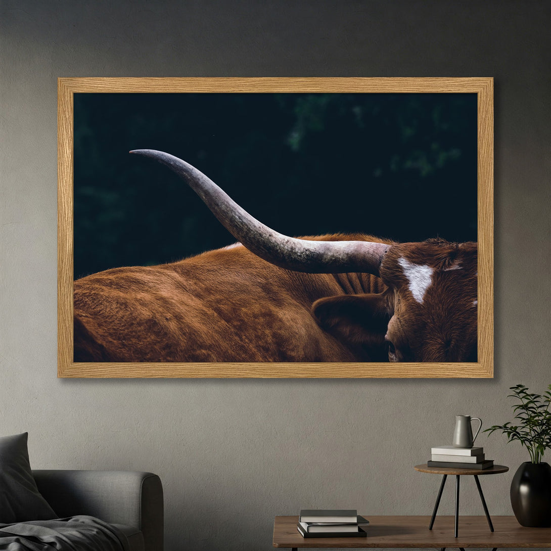 Framed Poster featuring a close-up of a longhorn, rustic style, with warm brown and deep green tones. Perfect wall art for your home!