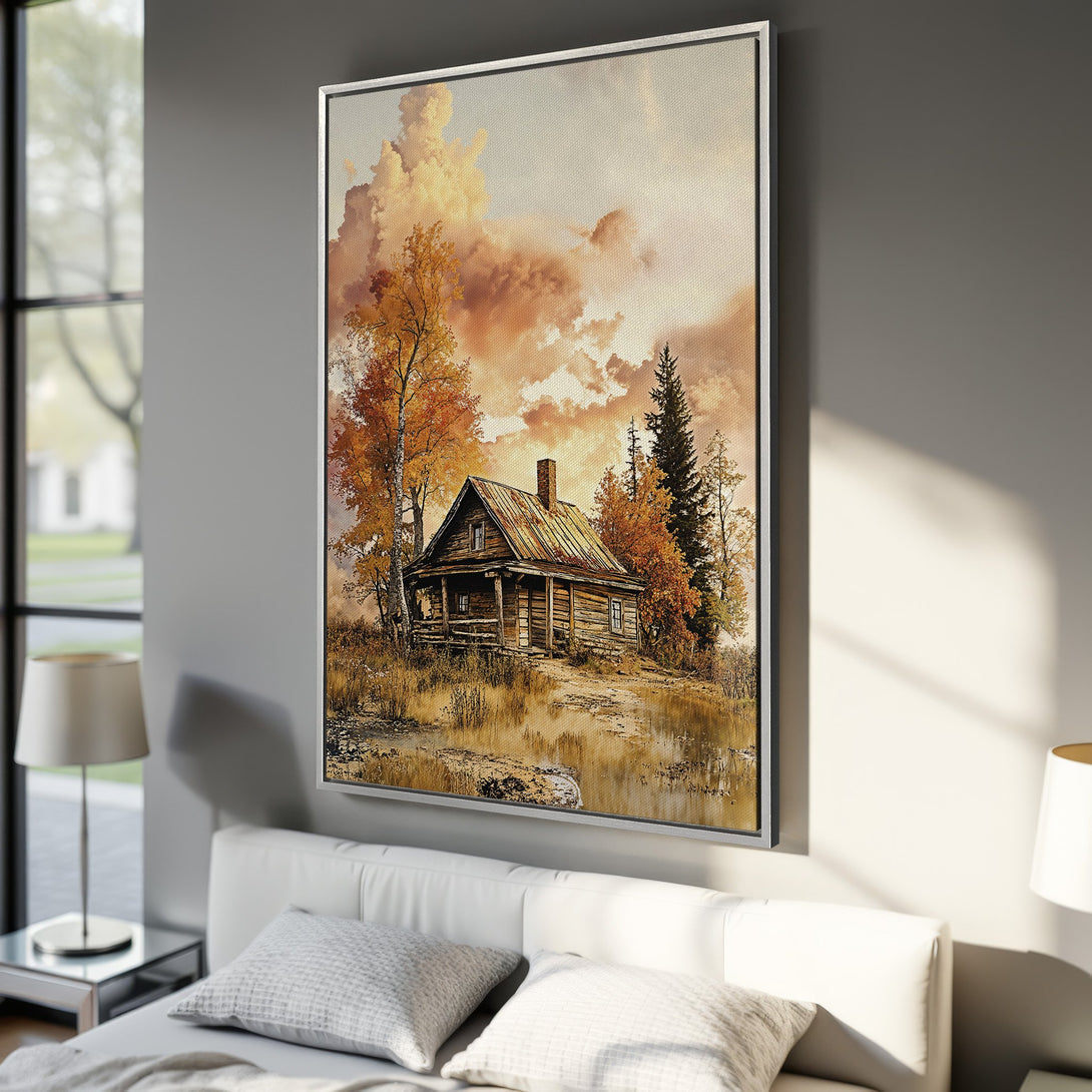 Framed Wall Art featuring a rustic cabin in a warm, autumnal color palette. Perfect for adding cozy charm to your home decor.