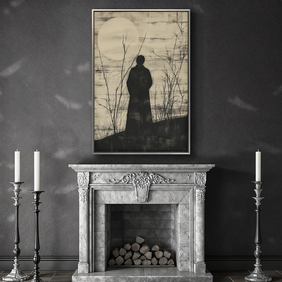 Framed Wall Art featuring a silhouette figure under a moon in a minimalist style, with a black and beige color palette, displayed in a dark interior.