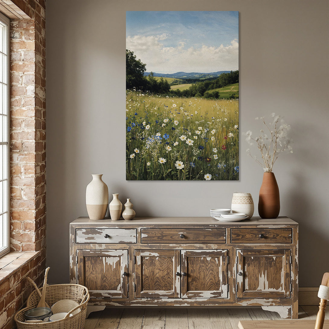 Framed Wall Art: Landscape Canvas Print with wildflowers in a field, featuring a blue sky and green hills. Warm, natural color palette.
