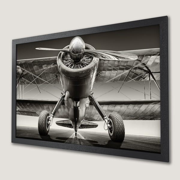 Framed Poster of a vintage biplane in sepia tones. Classic aviation art for your home.