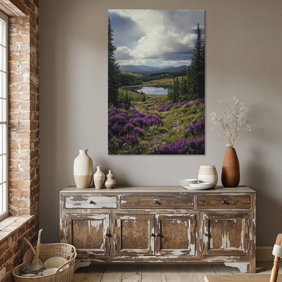 Framed Wall Art: Mountain landscape Canvas Print with purple flowers, green trees, and a lake. Earthy tones and a gold frame create a serene, natural aesthetic.