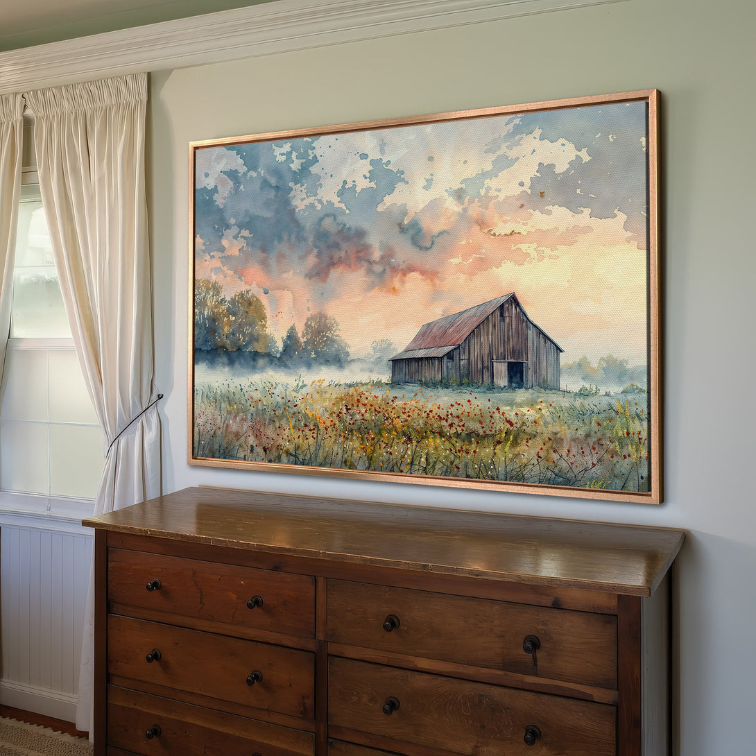 Framed Wall Art: Watercolor barn scene in warm sunset hues. Rustic farmhouse style canvas print, perfect for living room or bedroom decor.