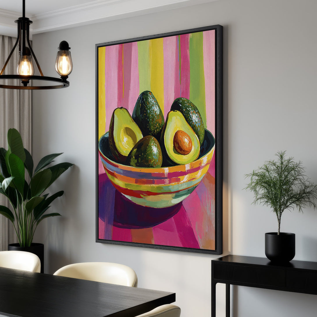 Framed Wall Art featuring vibrant avocado painting in a modern style with a colorful, striped background. Perfect for kitchen or dining room decor.