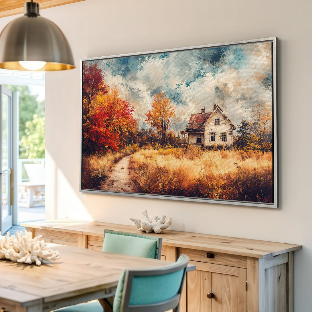 Framed Wall Art: Watercolor landscape of a rustic house in autumn. Warm, earthy tones of orange, gold, and blue create a cozy, inviting vibe. Perfect home decor!