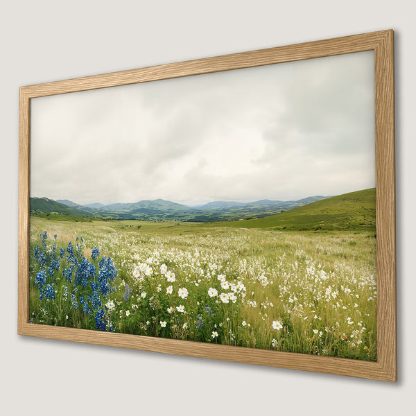 Framed Poster featuring a serene landscape with wildflowers. Soft, natural tones of green, blue, and white create a calming aesthetic. Perfect wall art.