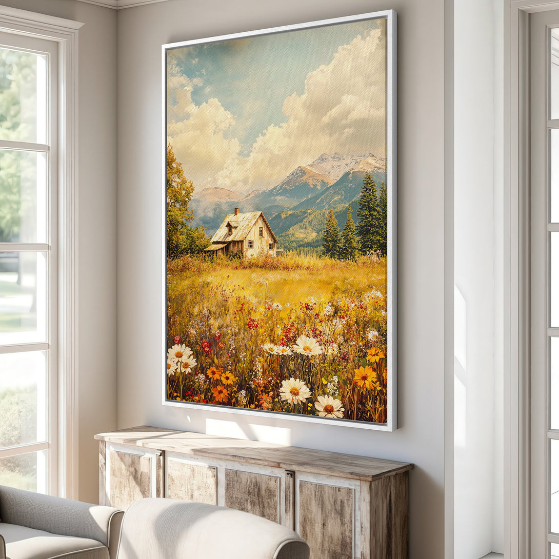 Framed Wall Art: Rustic cabin landscape Canvas Print. Warm, inviting color palette with wildflowers, mountains, and a charming cottage. Perfect for home decor.