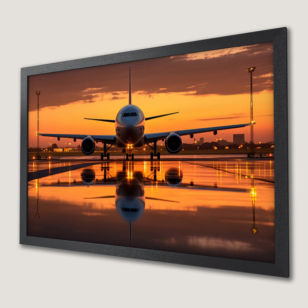 Framed Poster of airplane at sunset. Dramatic style with warm orange and yellow hues. Perfect aviation art.