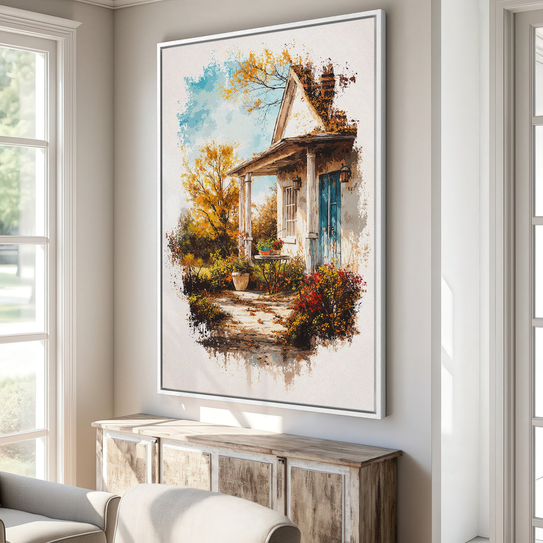 Framed Wall Art: Watercolor painting of a charming cottage in autumn colors. Warm, inviting artwork with a blue, gold, and brown palette. Perfect for home decor.
