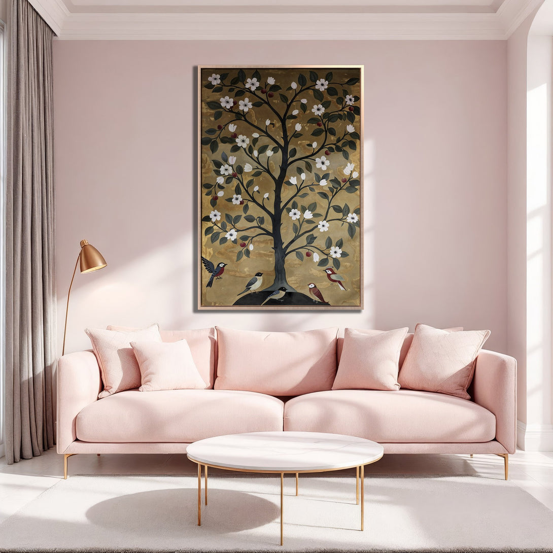 Framed Wall Art featuring a stylized tree with birds, in a gold, green, and white color palette, displayed in a modern, blush-toned interior.