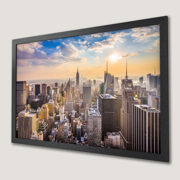 Framed Poster of NYC skyline at sunset. Warm color palette with a modern style, perfect for home decor.