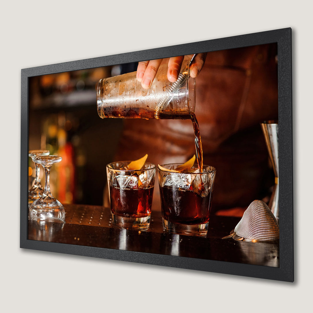 Framed Poster of a bartender pouring a cocktail. Warm, inviting tones of brown and amber create a cozy, stylish vibe. Perfect for your home bar!