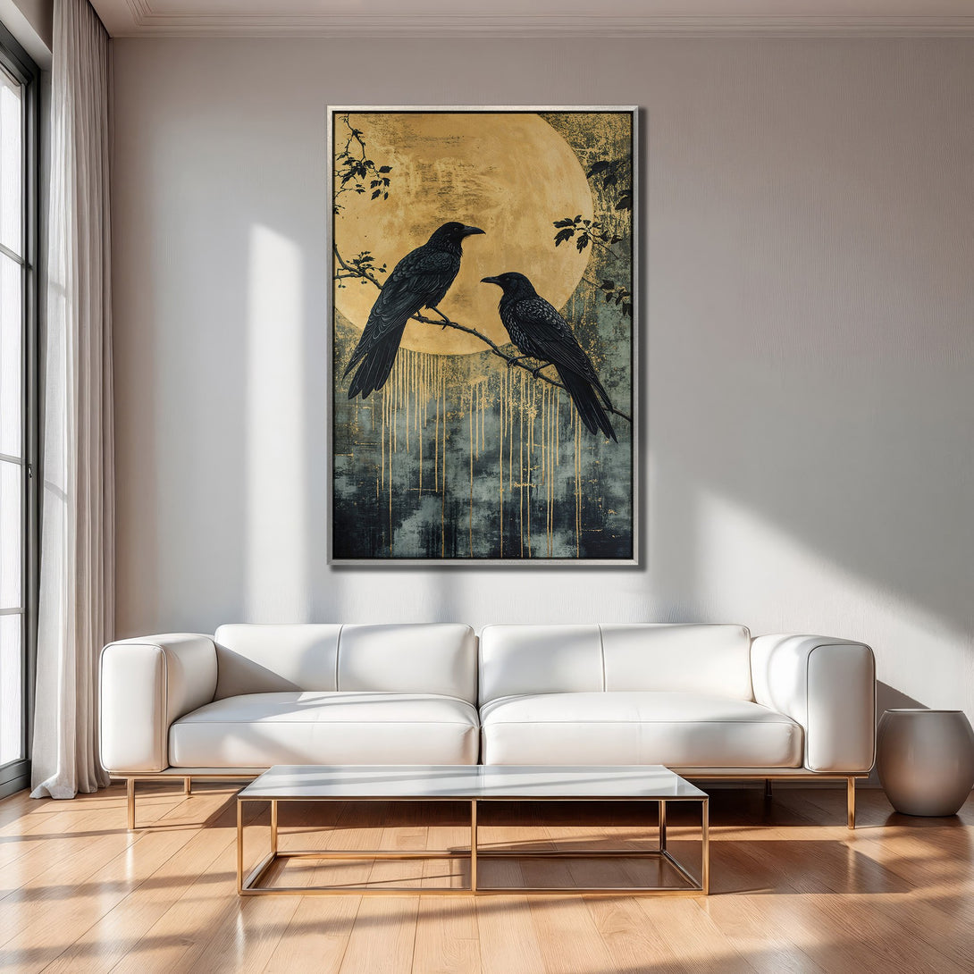 Framed Wall Art: Two black crows on a branch against a golden moon. Modern, abstract style with a moody, gold and teal color palette.