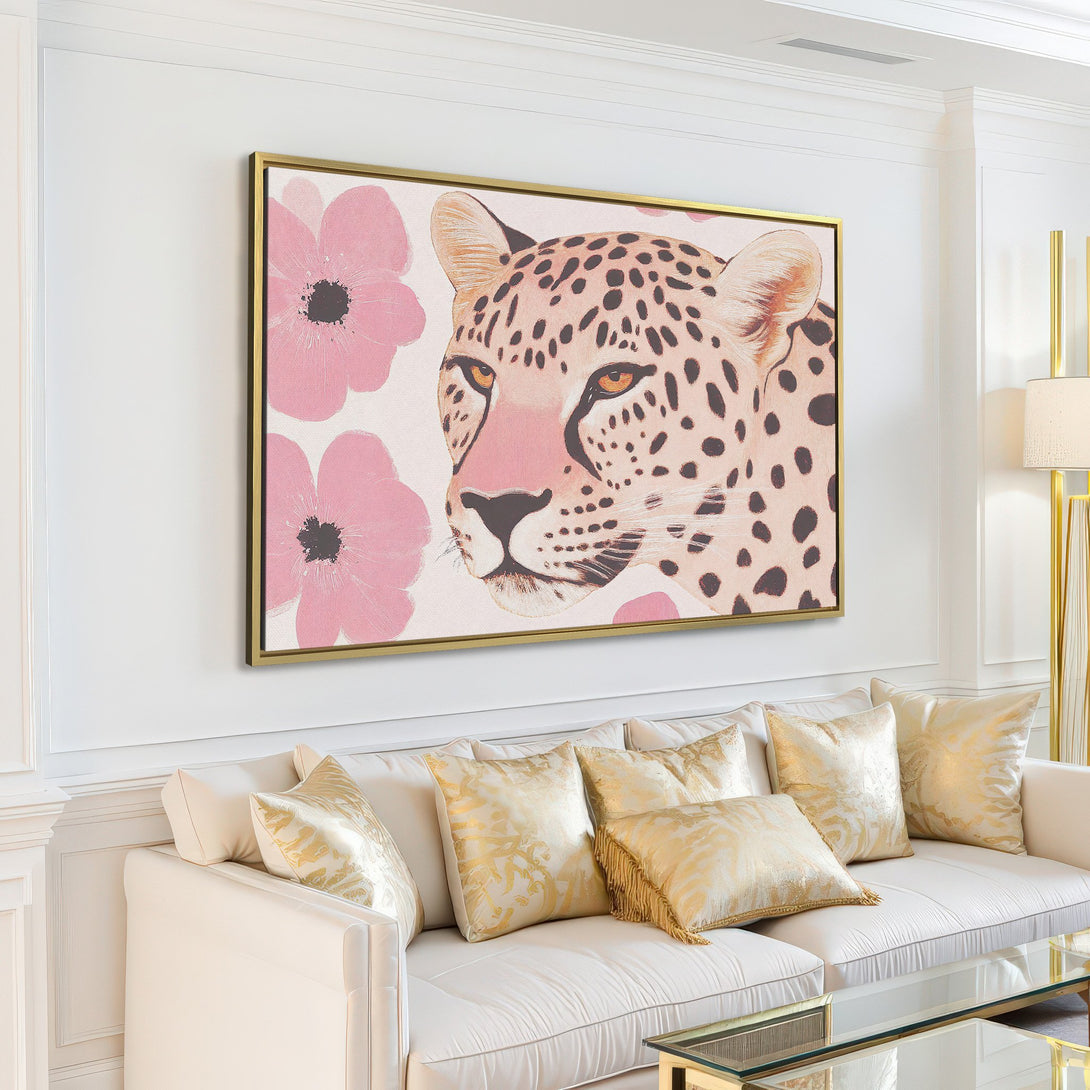 Canvas Print featuring a leopard portrait with pink floral accents, displayed in a modern living room. Soft neutral palette.