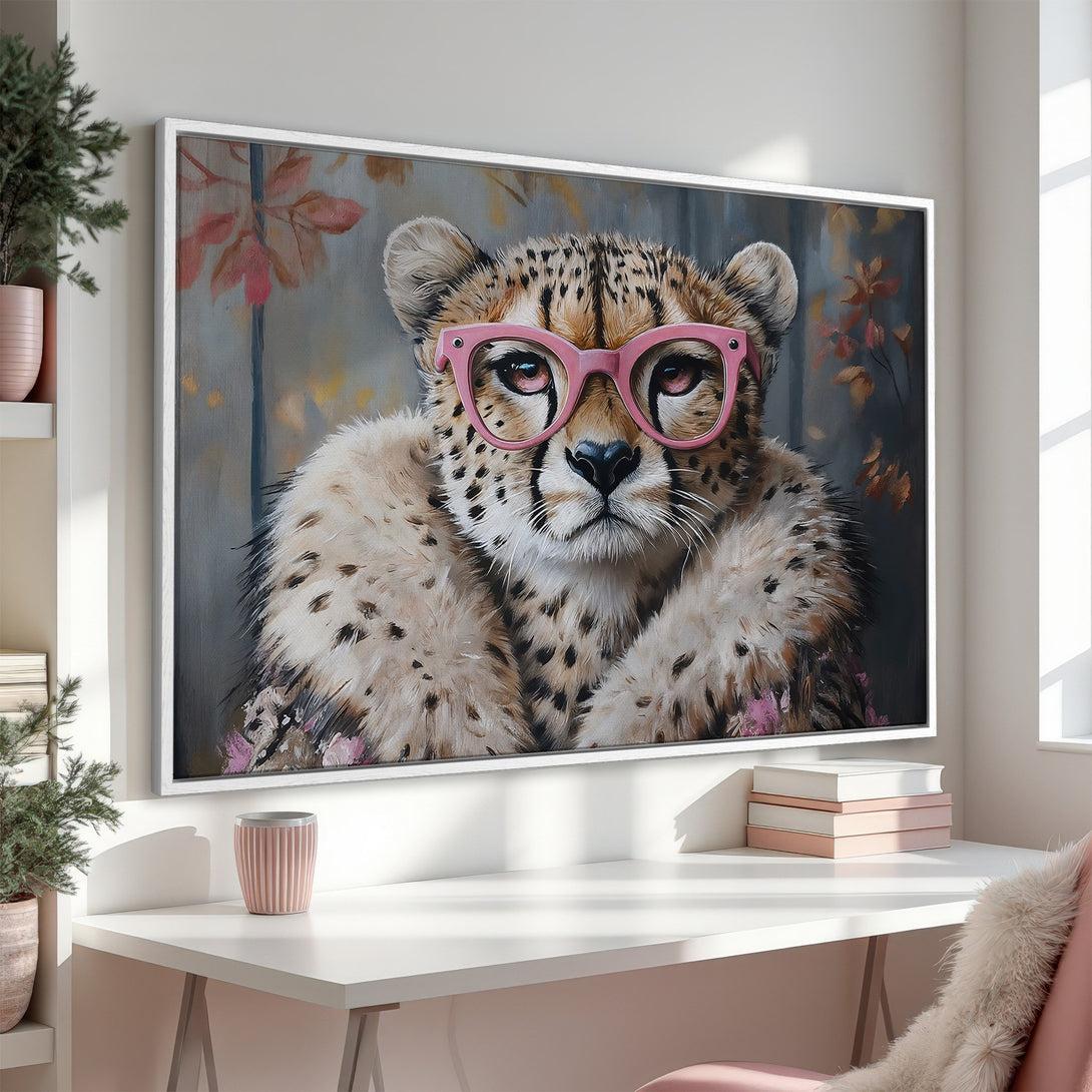 Framed Wall Art: Playful cheetah portrait with pink glasses. Modern art with neutral and pink tones, perfect for a stylish home. Shop our Canvas Prints!