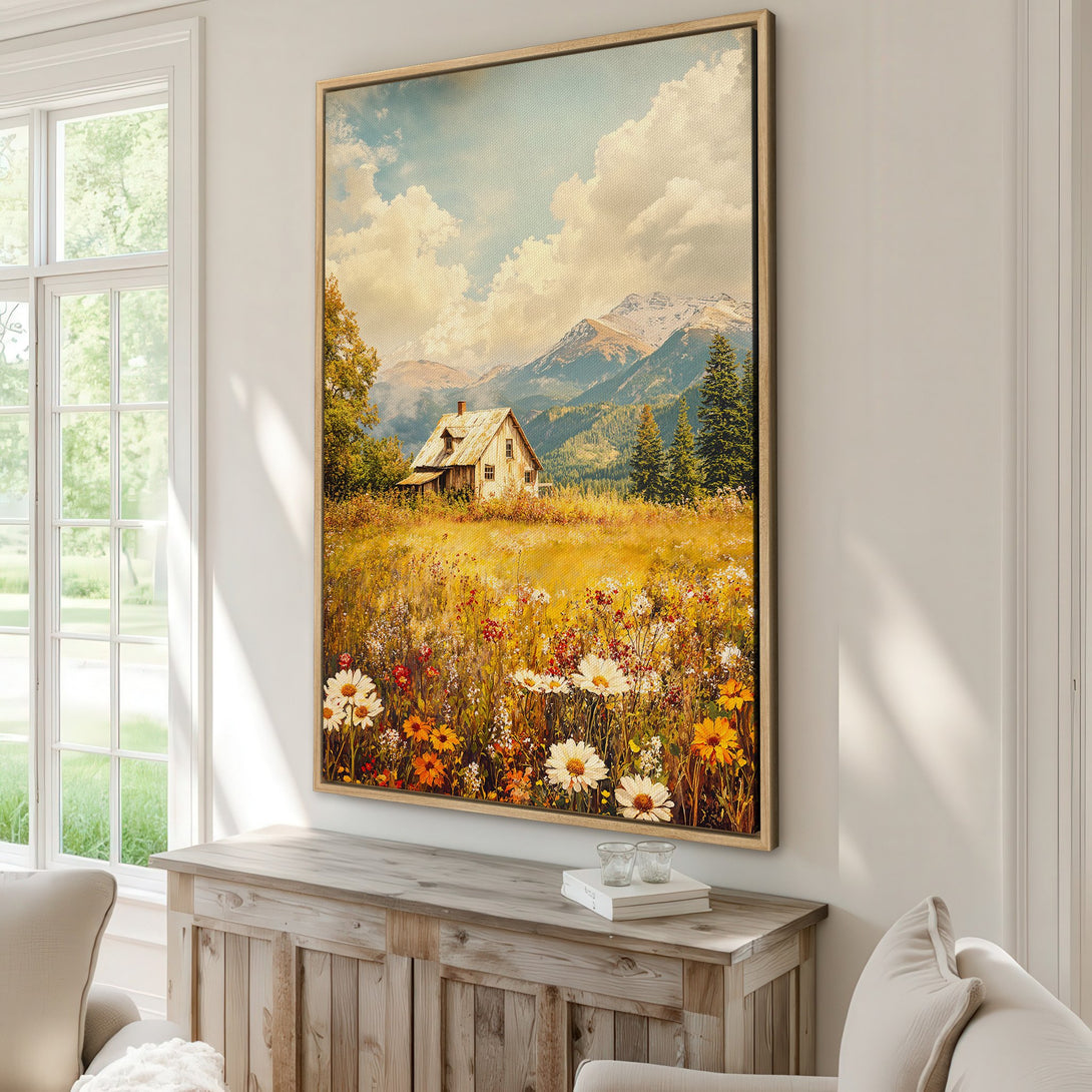 Framed Wall Art: Landscape Canvas Print featuring a charming cottage in a field of wildflowers with a warm, inviting color palette. Perfect for adding a touch of nature to your home.