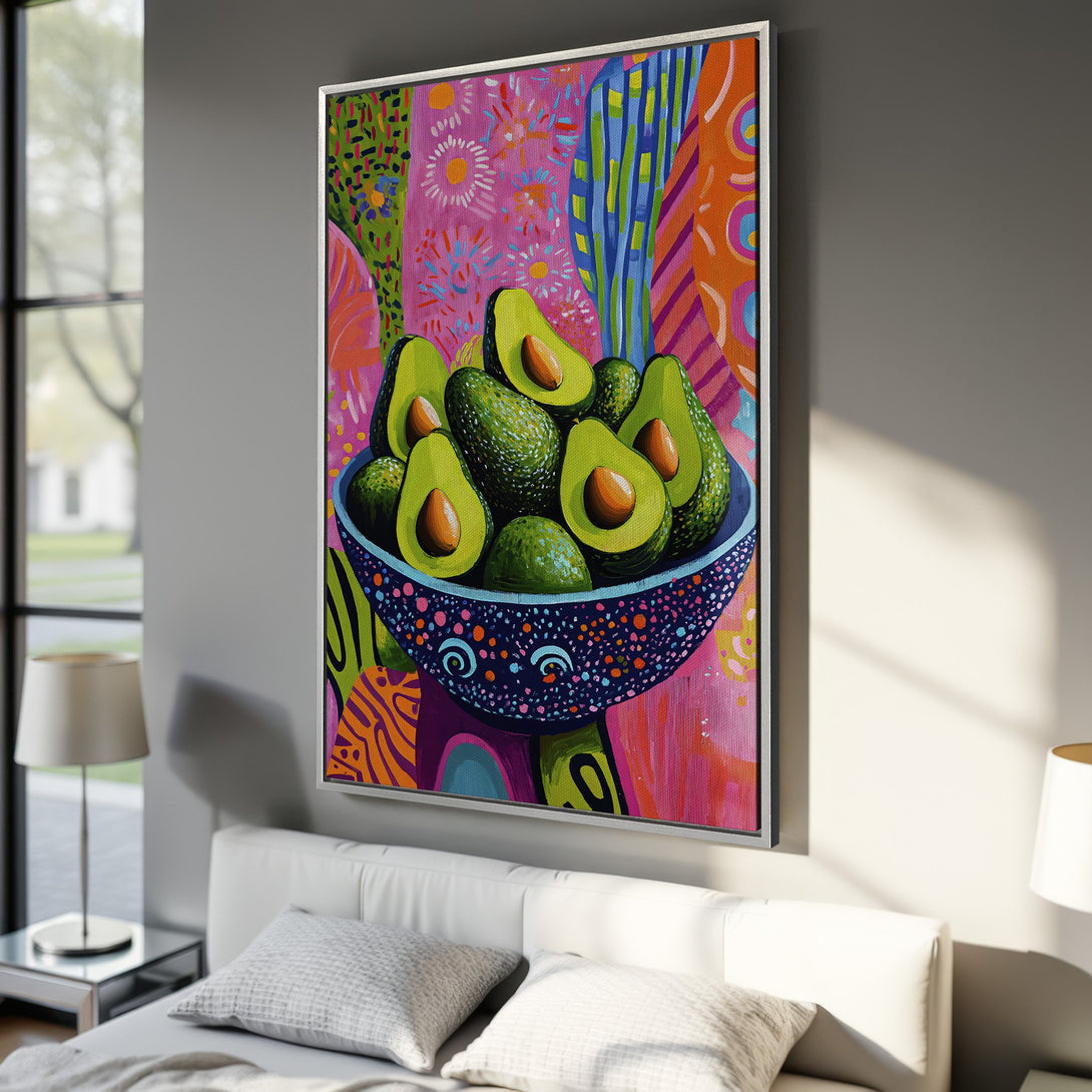 Framed Wall Art: Vibrant avocado painting in a colorful, abstract style. Pink, green, and orange hues add a pop of art to any room. Perfect for kitchen or dining decor.