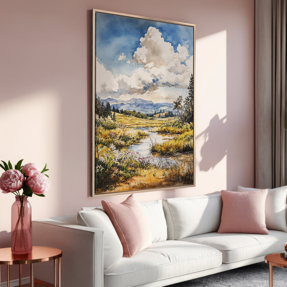Framed Wall Art: Watercolor landscape Canvas Print in a living room. Features a serene river scene with blue, yellow, and green tones. Perfect home decor.
