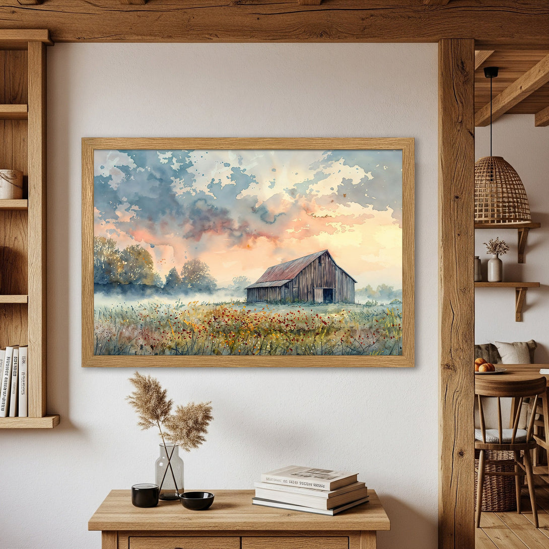 Framed Poster featuring a watercolor barn scene in a warm, sunset color palette. Perfect for rustic home decor.