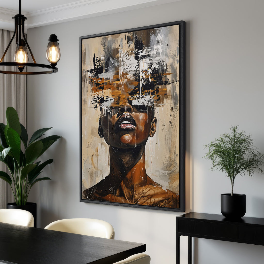 Framed Wall Art featuring an abstract portrait of a woman. Earth-toned color palette with black frame. Modern art for home decor.