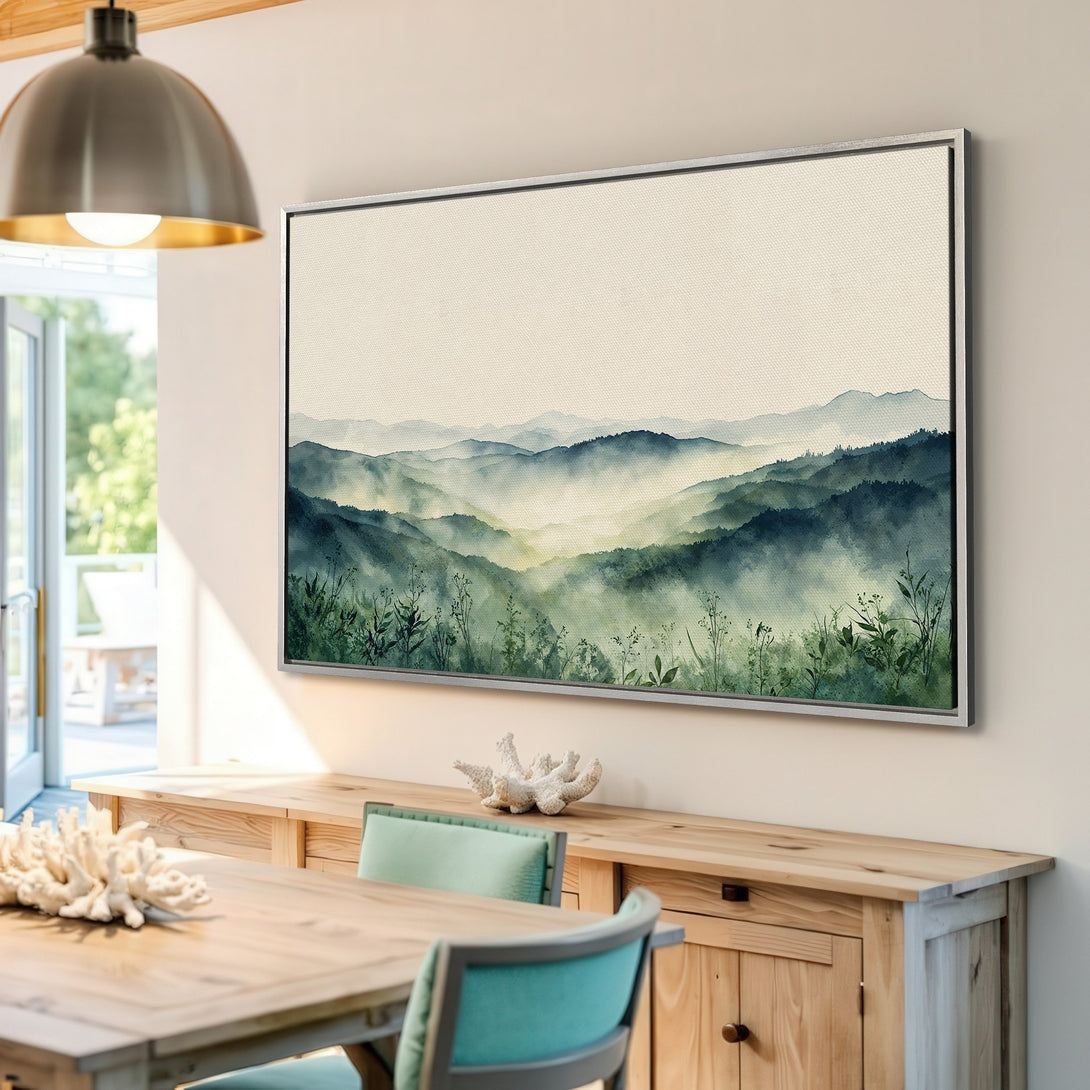 Framed Wall Art featuring a watercolor mountain landscape in shades of green and blue. Perfect for adding a touch of nature to your home decor.