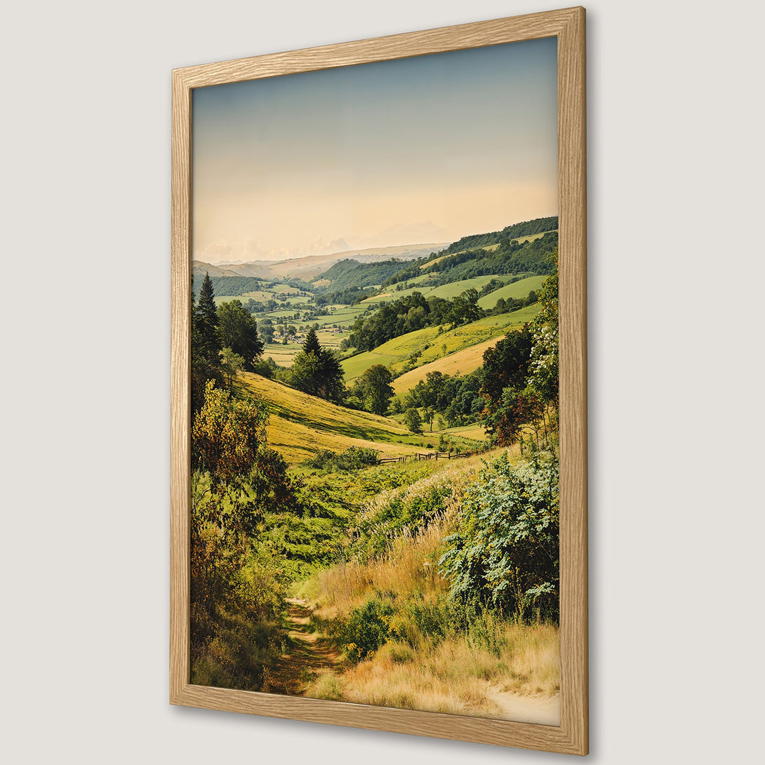Framed Poster of a serene landscape with rolling green hills, a path, and a warm, natural color palette. Perfect wall art!