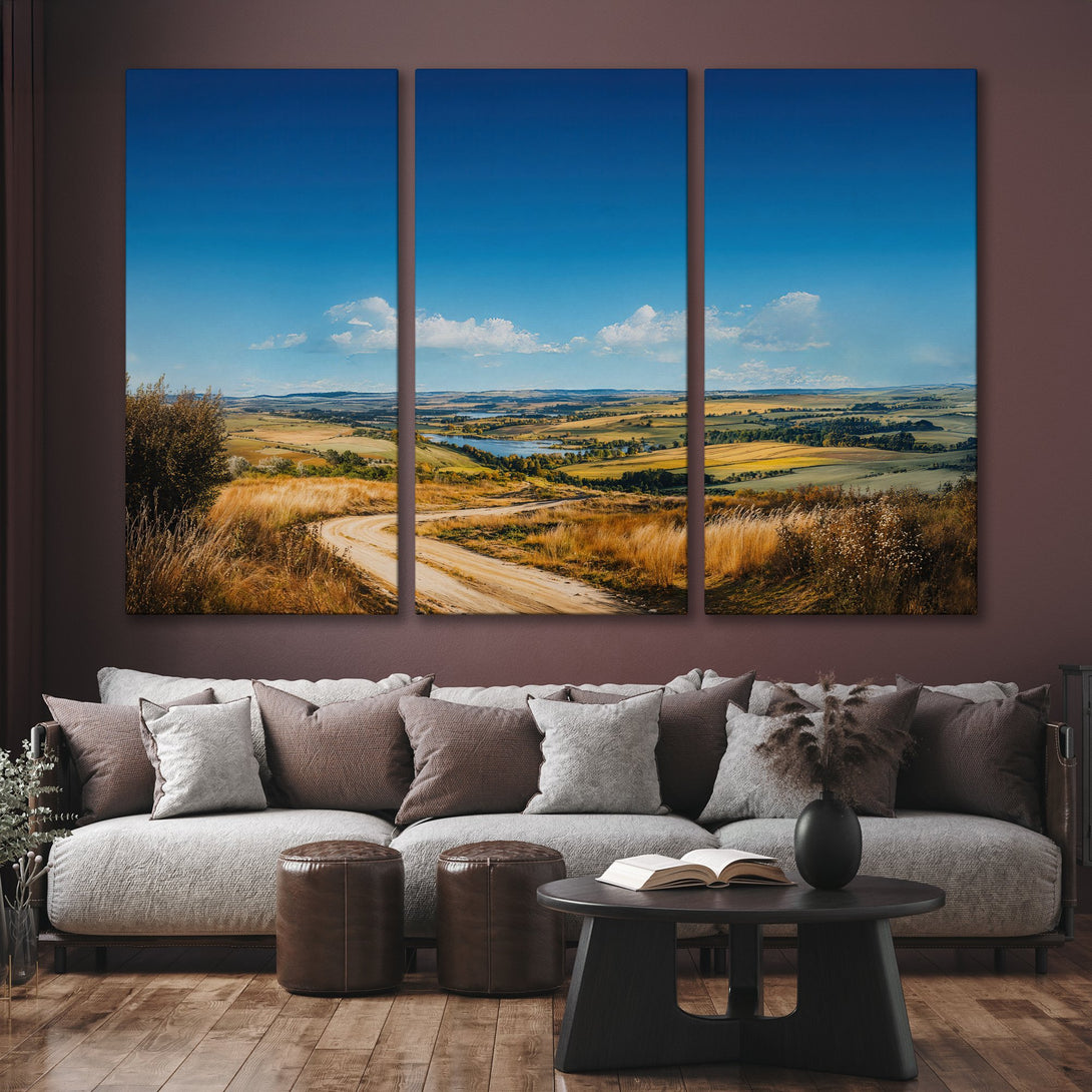 Canvas Print of a scenic landscape with a winding road, showcasing a blue sky and warm, earthy tones. Perfect for home decor.
