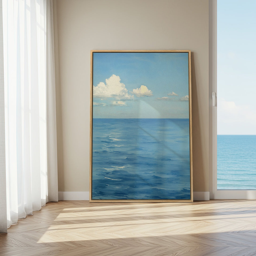 Framed Wall Art: Serene ocean view canvas print in blue and white. Coastal style art for a calming interior.