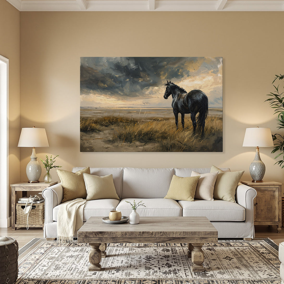 Framed Wall Art featuring a majestic black horse in a moody landscape. Earthy tones and dramatic sky create a captivating piece for your home.
