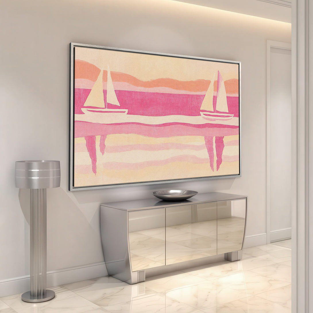 Framed Wall Art featuring a sailboat scene in a modern style. Pink and peach color palette creates a calming coastal vibe. Perfect for adding art to your home!