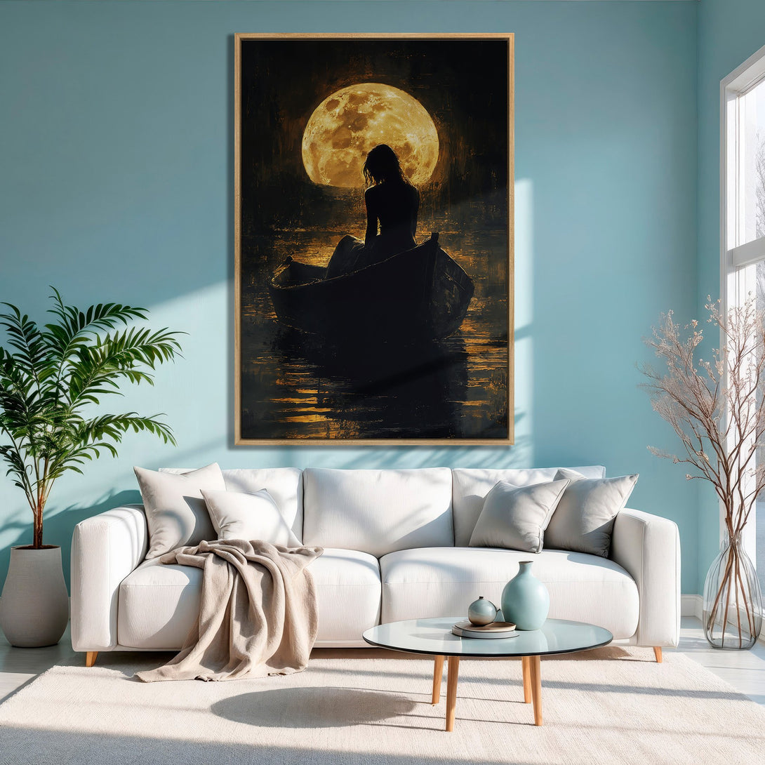 Framed Wall Art: Silhouetted woman in boat under moon, moody style, warm gold and black tones. Perfect for adding a touch of mystery to your space.