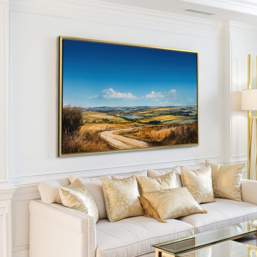 Canvas Print of a scenic landscape with a dirt road, blue sky, and golden fields. Adds a touch of nature's beauty to any interior, warm color palette.