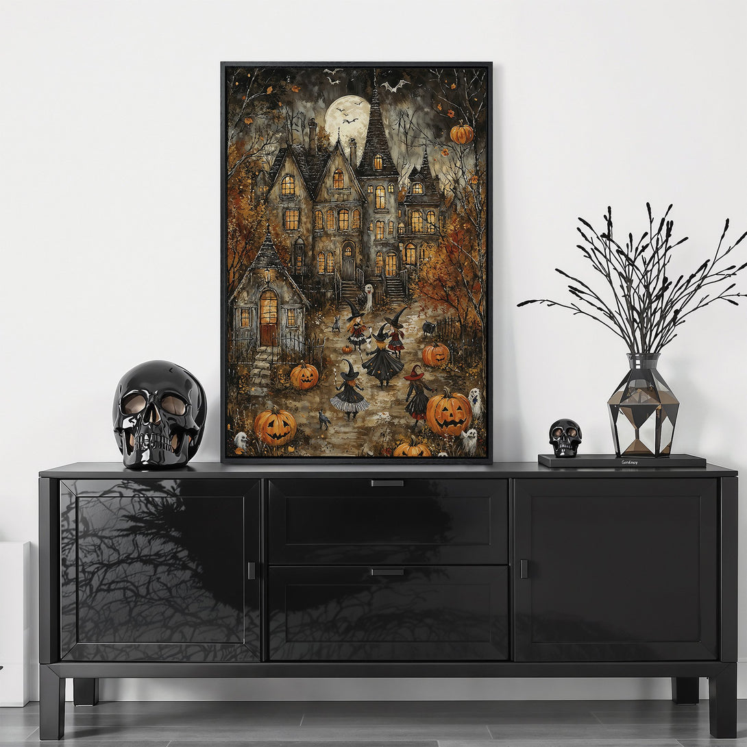 Framed Wall Art: Spooky Halloween scene with a haunted house, witches, and pumpkins. Warm, autumnal color palette. Perfect for fall decor!